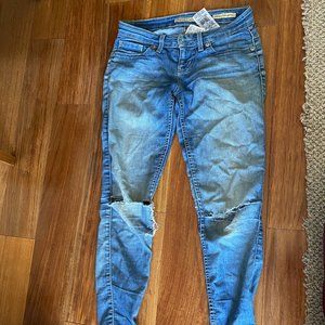 Distressed med wash denim jeans
